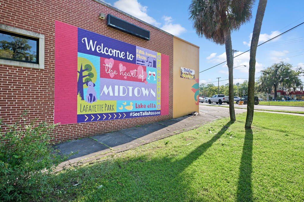 Mural that says "Welcome to Midtown", located on a brick wall of a local business located in Midtown Tallahassee, Florida