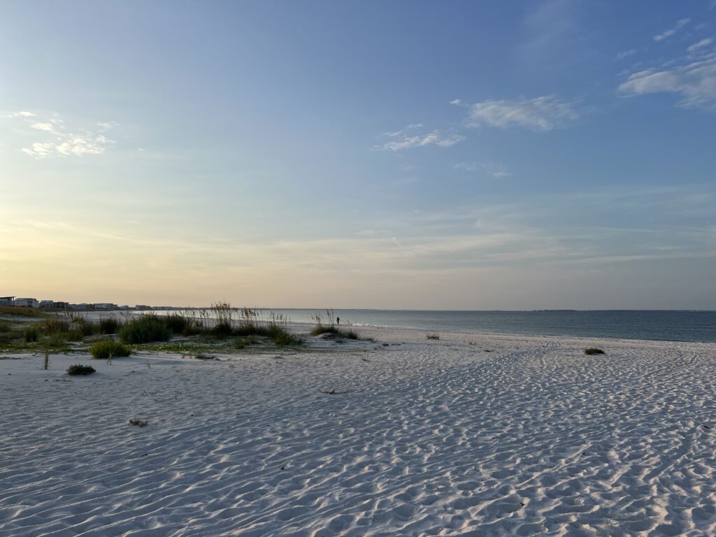 Mexico Beach, FL - LS The beach at sunrise in Mexico Beach, Florida, with soft white sand and the ocean in the distance