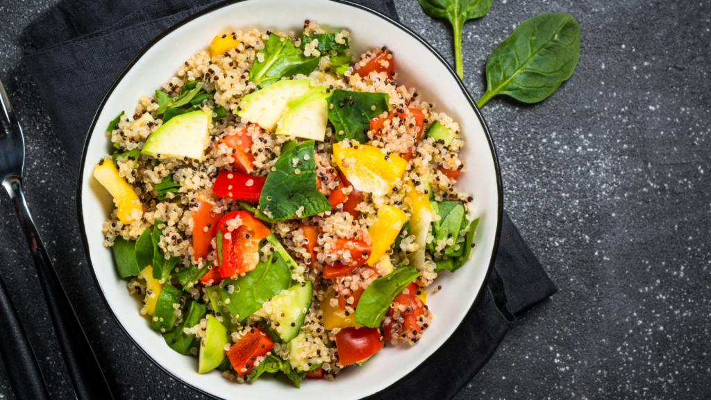 Salad with couscous on a black table